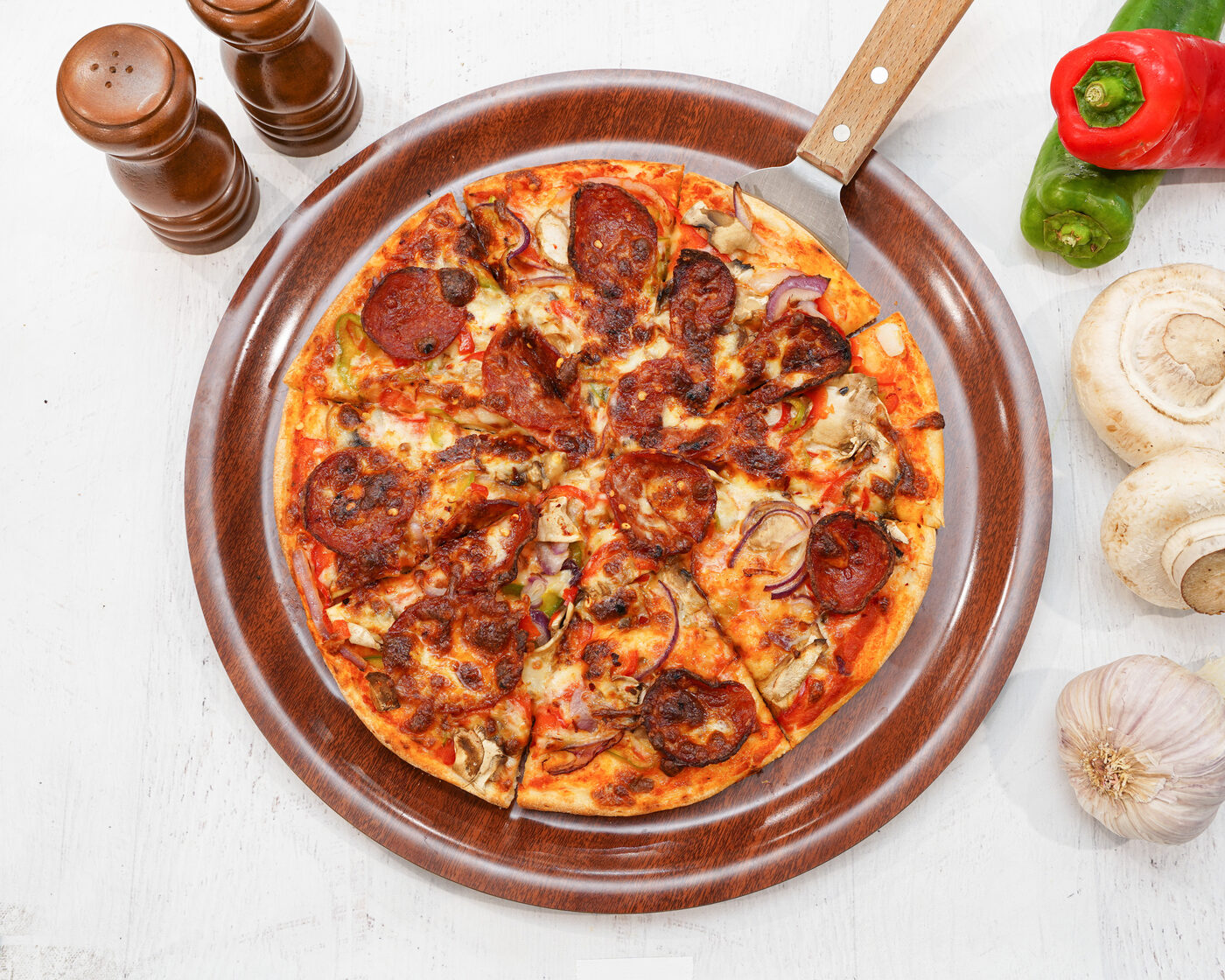 Mexicana style pizza with pepperoni, mushroom and capsicum