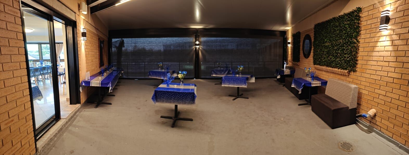 Sam's Italian Restaurant's covered outdoor terrace set with tables
